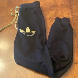 Adidas black joggers with gold and jeweled emblem- like new Size small (or XS)